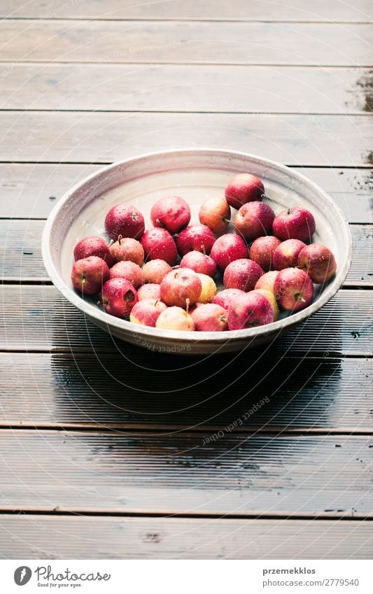 Closeup of big bowl of fresh red apples on wooden table Vegetable Fruit Apple Vegetarian diet Bowl Summer Table Nature Autumn Wood Fresh Delicious Natural Juicy