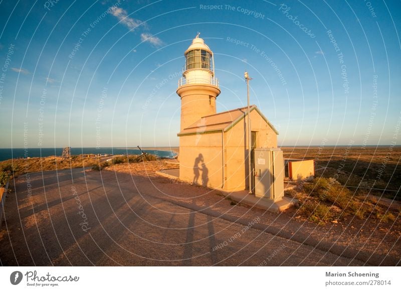 lighthouse Freedom Summer vacation Sun Hill Rock Coast Lighthouse Touch Brown Yellow Authentic Whimsical Australia Sunset Shadow play Colour photo Exterior shot