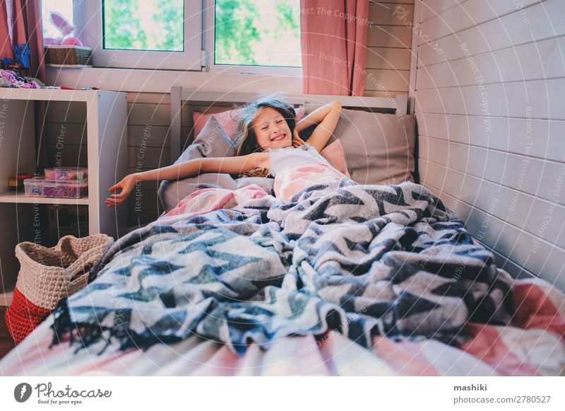 happy kid girl waking up in early morning in her room, lying in bed Lifestyle Happy Relaxation Playing Bedroom Child Schoolchild Infancy Laughter Sleep Dream