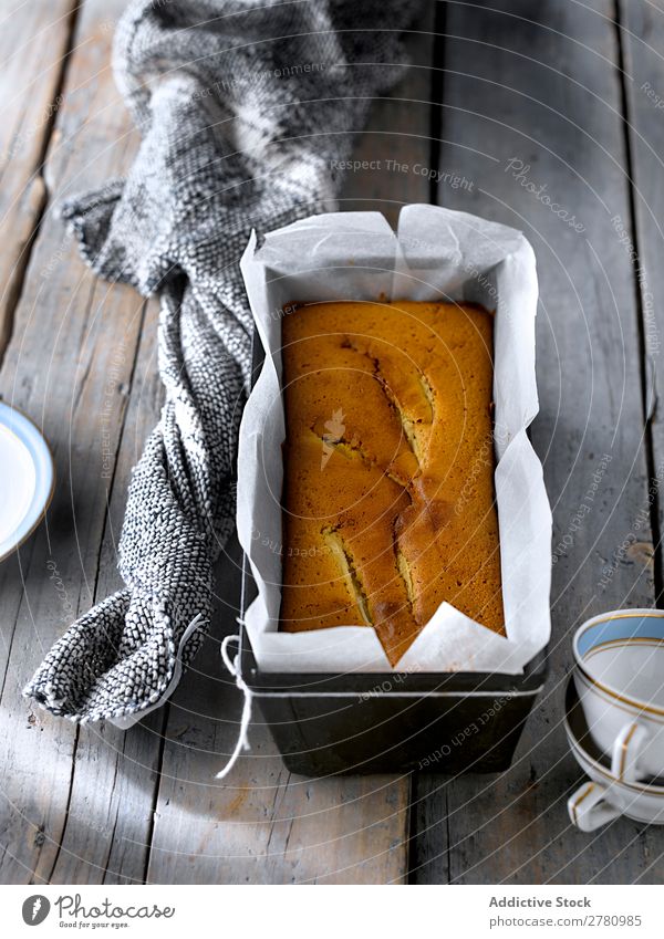 Close-up of baked golden pear cake in metal form with parchment on rustic gray table. Cake Form (document) Baking Pear Cooking Gold Bakery Kitchen Dessert