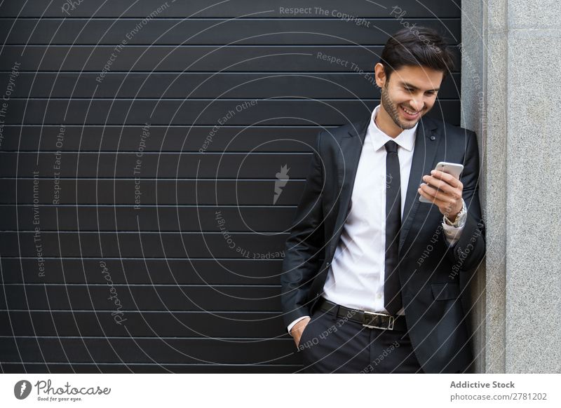 Elegant Young Businessman in the Street Using a Mobile Phone Man Fashion handsome Youth (Young adults) Looking Model Human being Background picture Suit Modern