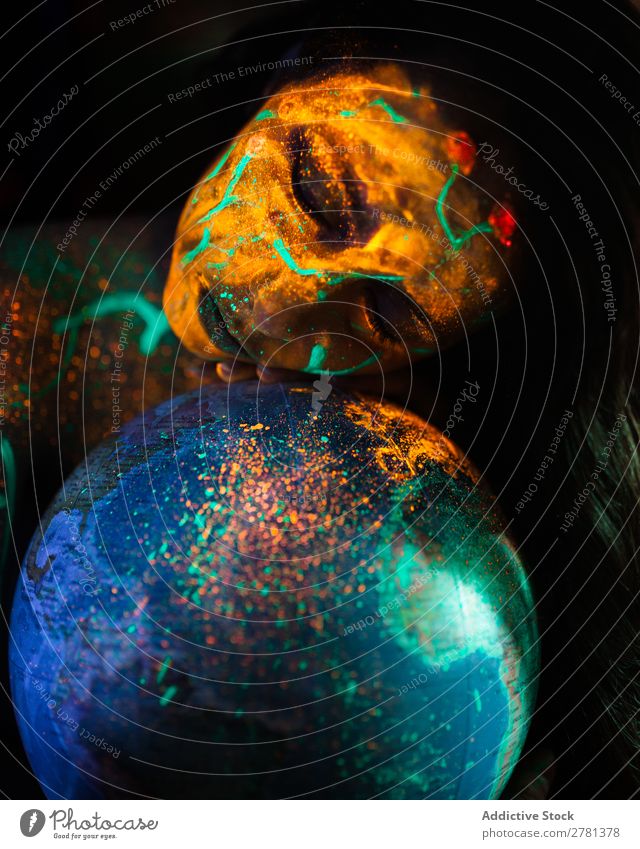 Woman with luminous paint and globe Youth (Young adults) pretty Colour Globe Model Map eyes closed Painting (action, artwork) Fluorescent Illuminate Art Neon