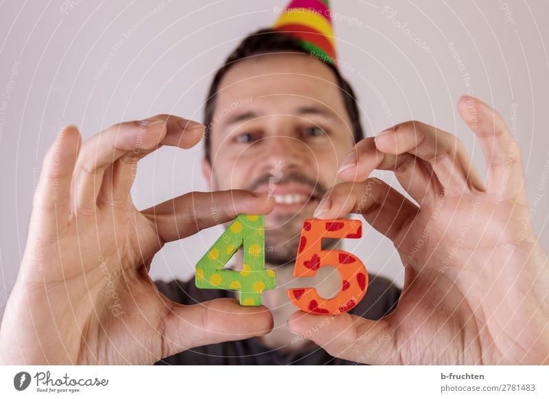 Man holding two numbers in his hand, anniversary celebration Party Event Feasts & Celebrations Carnival Birthday Adults Face Hand Fingers 1 Human being Hat