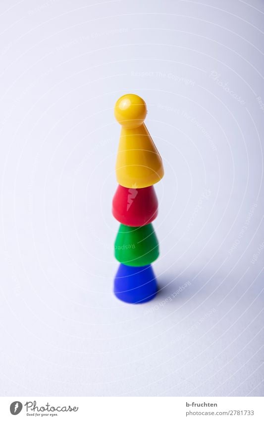 A stack of game pieces Success Team Group Toys Select Piece Stack Consecutively Upward Tower Build Playing Attachment Tall Colour photo Multicoloured