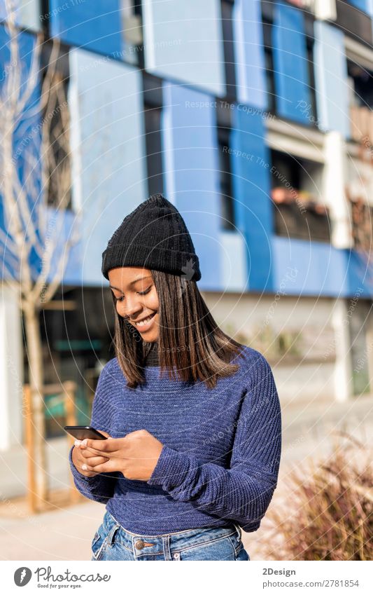 Happy woman with hat in city street, while using technology Style Beautiful Hair and hairstyles PDA Technology Human being Feminine Young woman