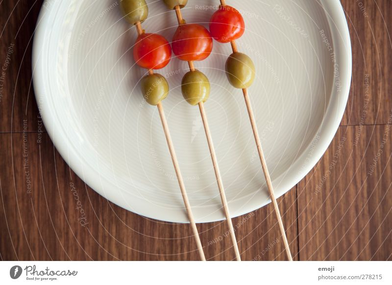 green-red Food Vegetable Vegetarian diet Diet Italian Food Plate Healthy Green Red Appetizer Impaled Olive Tomato Colour photo Close-up Detail Deserted Day