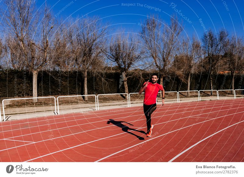 young athlete man running in the lanes. Daylight Lifestyle Leisure and hobbies Sports Jogging Human being Masculine Young man Youth (Young adults) Man Adults 1