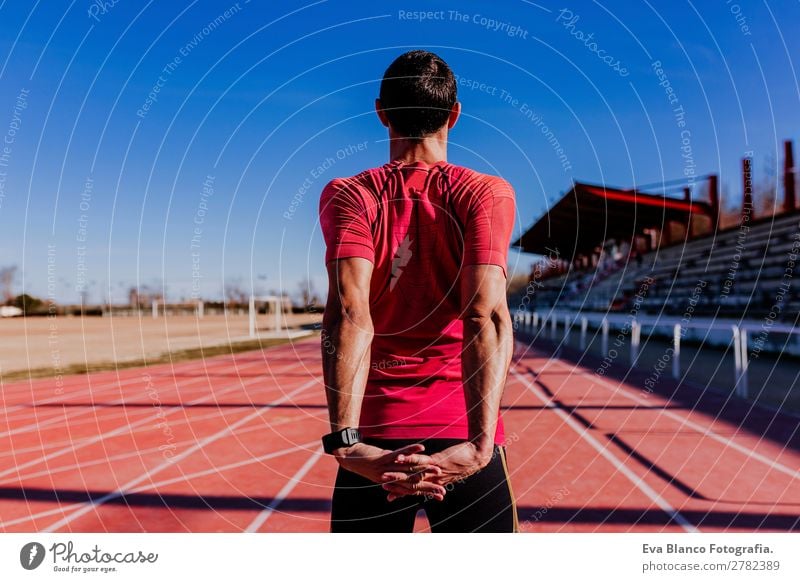 young runner man athlete at the race track. Sports outdoors Lifestyle Leisure and hobbies Track and Field Jogging Masculine Young man Youth (Young adults) Man