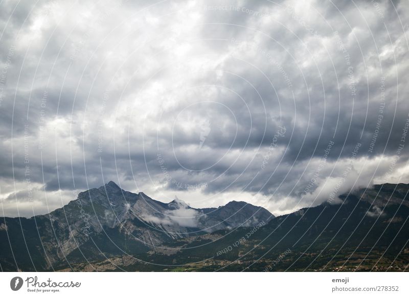 mountain Environment Nature Landscape Sky Clouds Storm clouds Climate Climate change Bad weather Wind Gale Thunder and lightning Alps Mountain Threat Gray