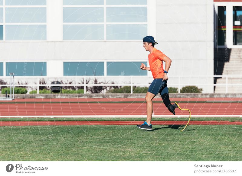 Disabled man athlete training with leg prosthesis. Man Running Runner Athlete Sports prosthetic Handicapped disabled amputation amputee invalid invalidity Speed