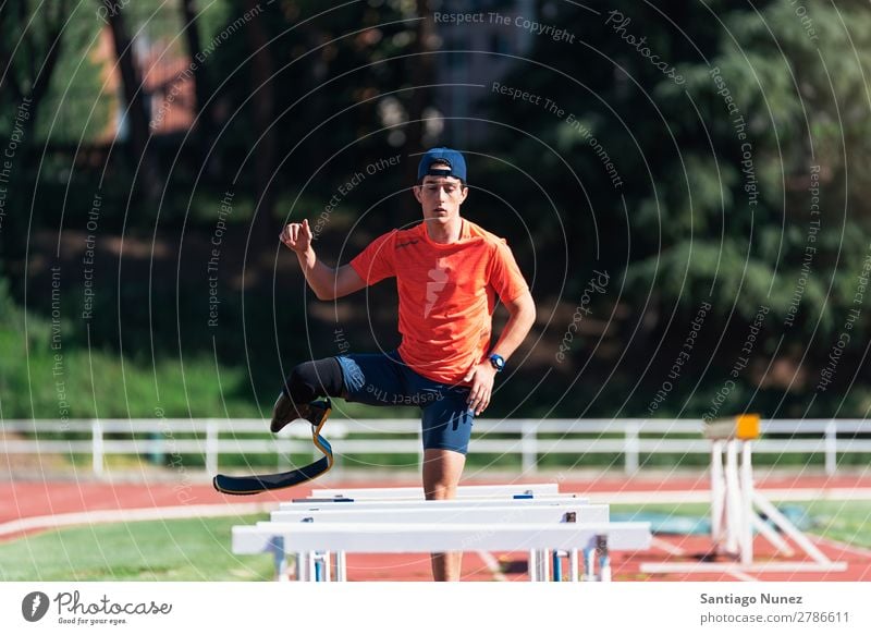 Disabled man athlete training with leg prosthesis. Man Running Runner Fitness Jump Athlete Sports prosthetic Handicapped disabled paralympic amputation amputee