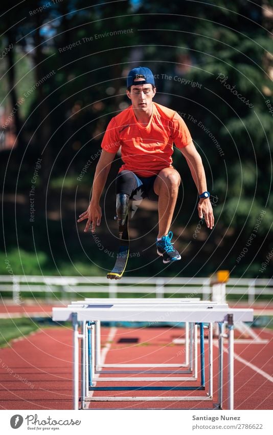 Disabled man athlete training with leg prosthesis Man Running Runner Jump Athlete Sports prosthetic Handicapped disabled amputation amputee invalid invalidity