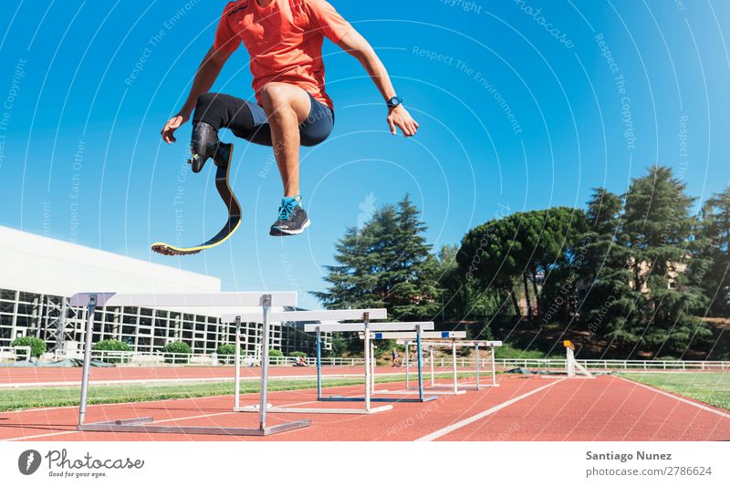 Disabled man athlete training with leg prosthesis. Man Running Runner Jump Athlete Sports prosthetic Handicapped disabled paralympic amputation amputee invalid