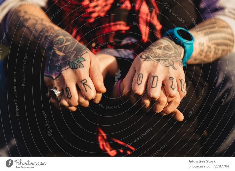 Man in tattoos holding hands of woman Couple Tattoo Ring Observe Scarf Weather Sunbeam Red Youth (Young adults) Woman Hipster embracing Time gem sash Embrace