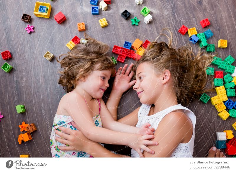 two beautiful sisters playing at home Lifestyle Joy Playing Kindergarten Child School Human being Feminine Toddler Girl Sister Family & Relations Infancy