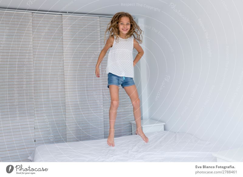 beautiful kid girl jumping on bed Lifestyle Joy Beautiful Leisure and hobbies Playing Summer Bed Bedroom Child Human being Feminine Toddler Girl Mother Adults