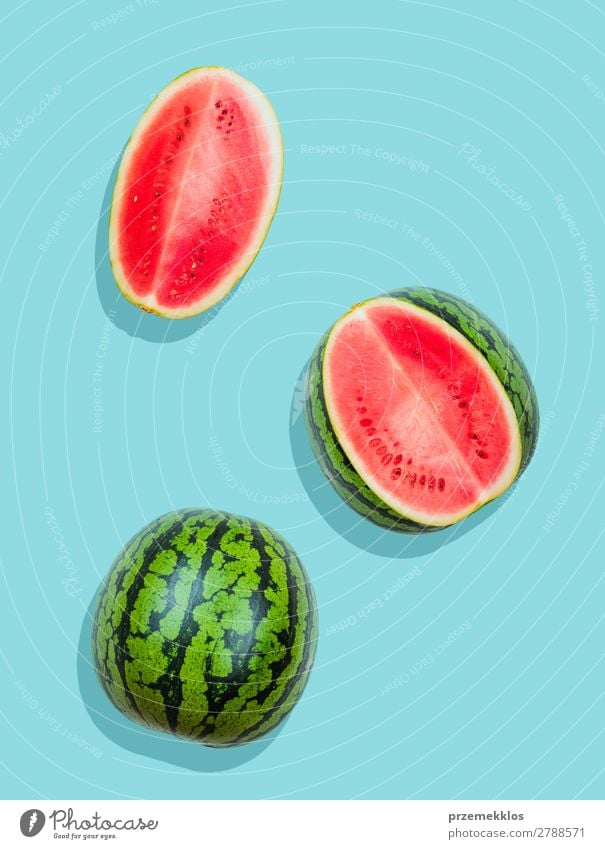 Pieces of watermelon on plain blue background Fruit Nutrition Eating Vegetarian diet Diet Summer Fresh Bright Delicious Natural Juicy Clean Green Red flat food