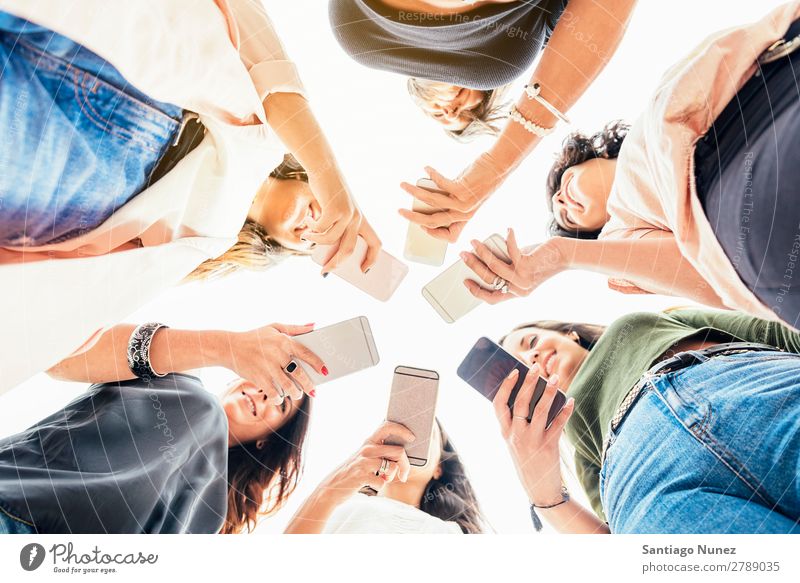 Big Group of friends using cellphones. Friendship Mobile Telephone PDA Human being Youth (Young adults) Woman Smart Technology Beautiful Lifestyle pretty