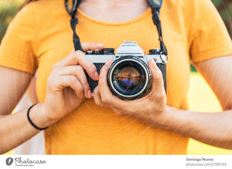 Close up of a photographer with her camera. Camera Photographer Professional Photography analogical Bag Easygoing casual dressing reflex caucasian ethnicity