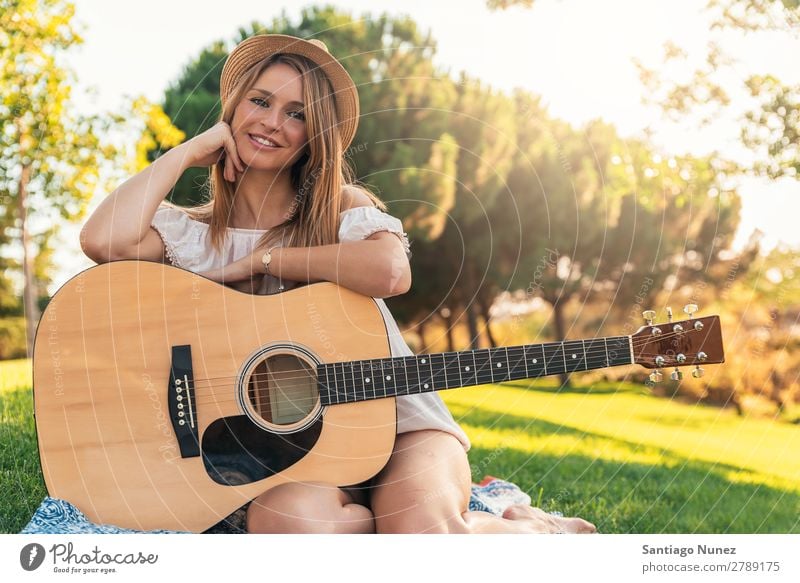 Beautiful woman playing guitar. Woman Picnic Youth (Young adults) Guitar Guitarist Park Happy Summer Human being Joy Playing Music Adults Girl pretty