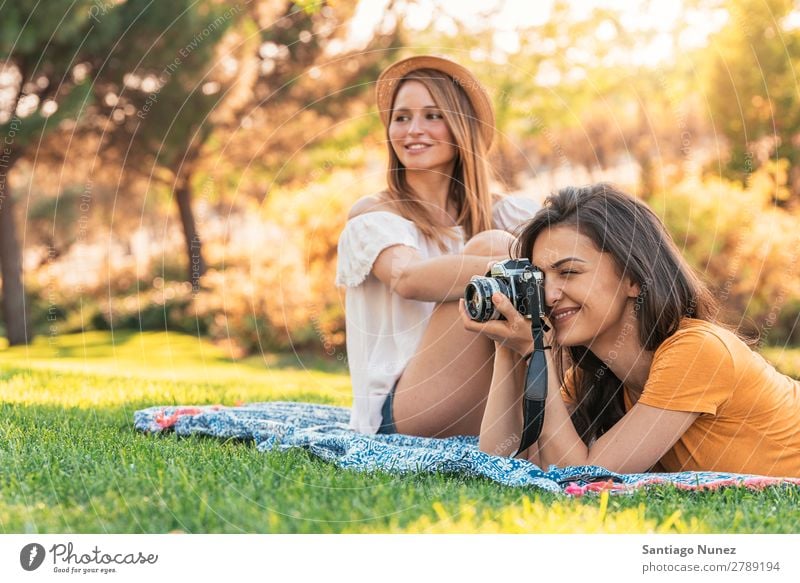 Beautiful women having fun taking any photography in the park. Woman Picnic Friendship Youth (Young adults) Park Happy Photographer session Photography Take