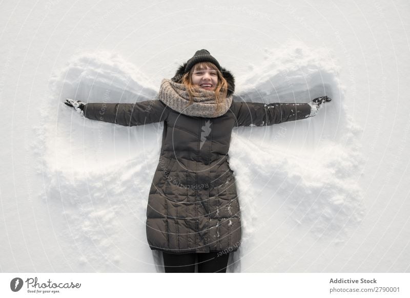 Woman In Winter Wear Making Snow Angel A Royalty Free Stock Photo From Photocase