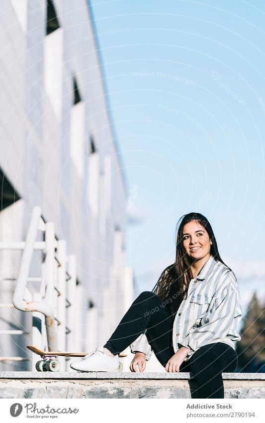 Young woman posing with skateboard 1 Hold Vantage point Adults Skateboarding Youth (Young adults) Leisure and hobbies Longboard Sit Joy Easygoing Girl Street