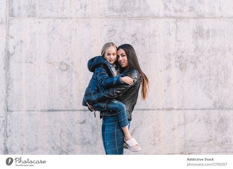 Girl holding up young sister 2 Spring Emotions Hold Child Relationship Playing sisters Joy Love Happiness Freedom Running Beautiful Youth (Young adults) Infancy