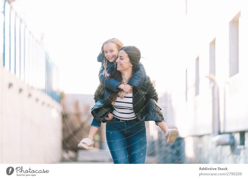 Woman doing young sister piggyback 2 Spring Emotions Hold Child Relationship Playing sisters Joy Girl Love Happiness Freedom Running Beautiful