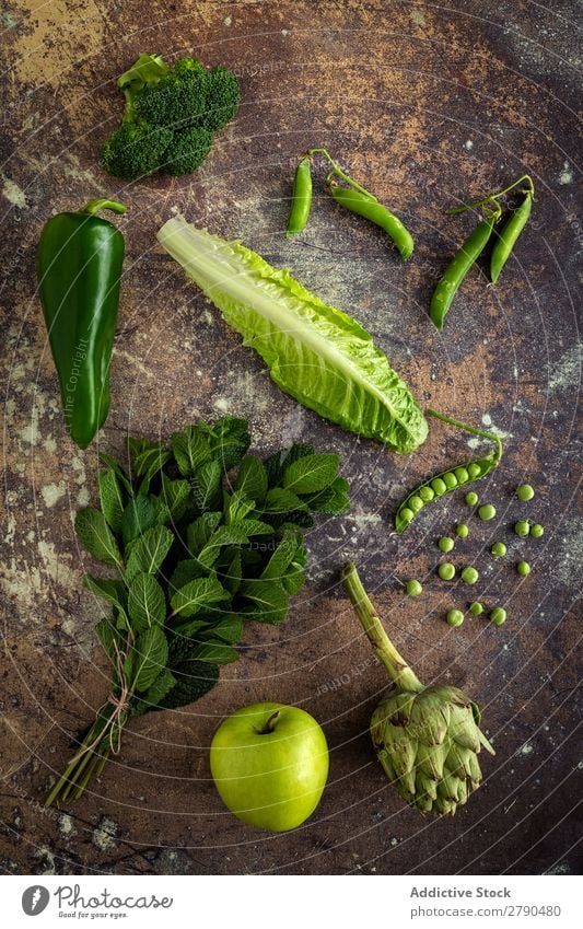 Mix of fruits and vegetables in green color Vegetable Food Detox assortment Background picture Mint Lettuce Broccoli green peas Apple Artichoke Pepper Diet