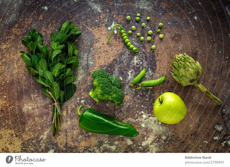 Mix of fruits and vegetables in green color Vegetable Food Detox assortment Background picture Mint Lettuce Broccoli green peas Apple Artichoke Pepper Diet