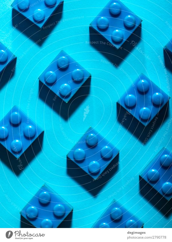 Blue unicolour plastic geometric cubes. Construction toys Design Playing Child Infancy Toys Brick Plastic Build Colour blocks background rows Arranged LEGO