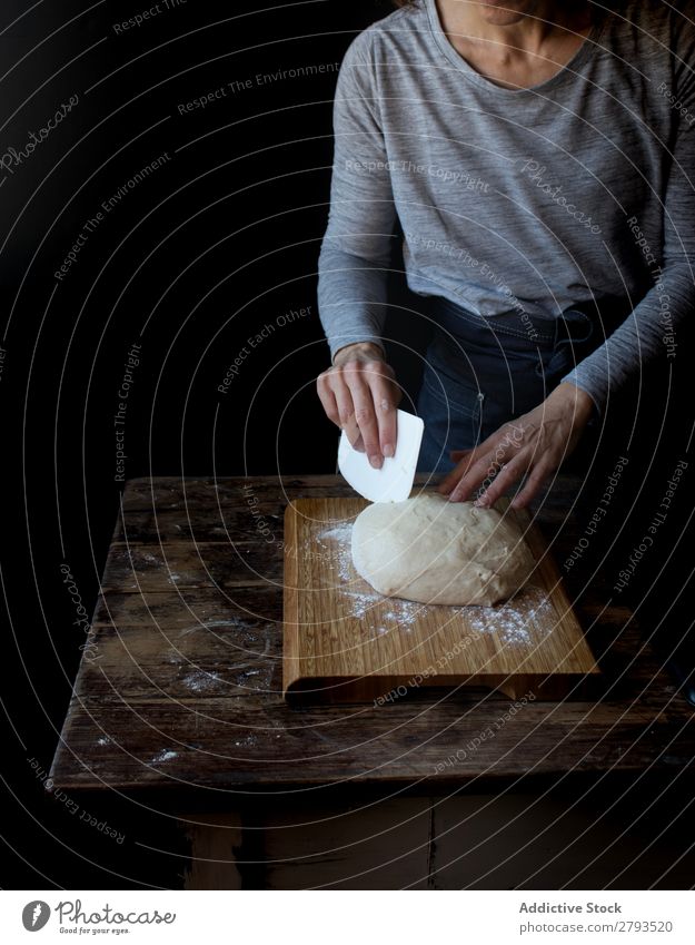 Person near cutting board with dough and flour on table Table Human being Dough Chopping board Flour loaf Wood Baked goods Set Meal Bakery Sweet Dessert Pie