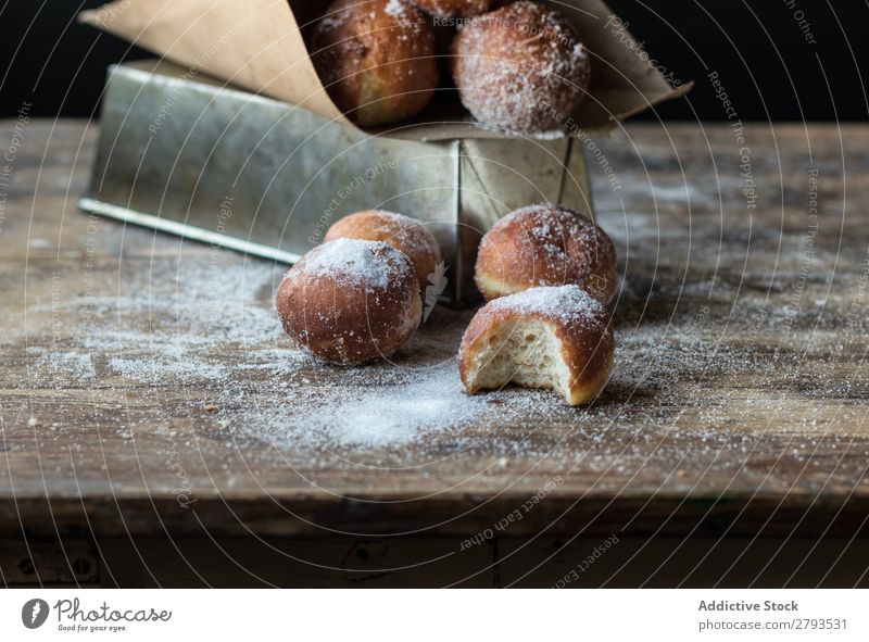 Baked cakes in craft paper on table Cake Table Baking Craft (trade) Paper loaf Sugar powdered darkness Food Baked goods Set Meal Bakery Sweet Dessert Pie