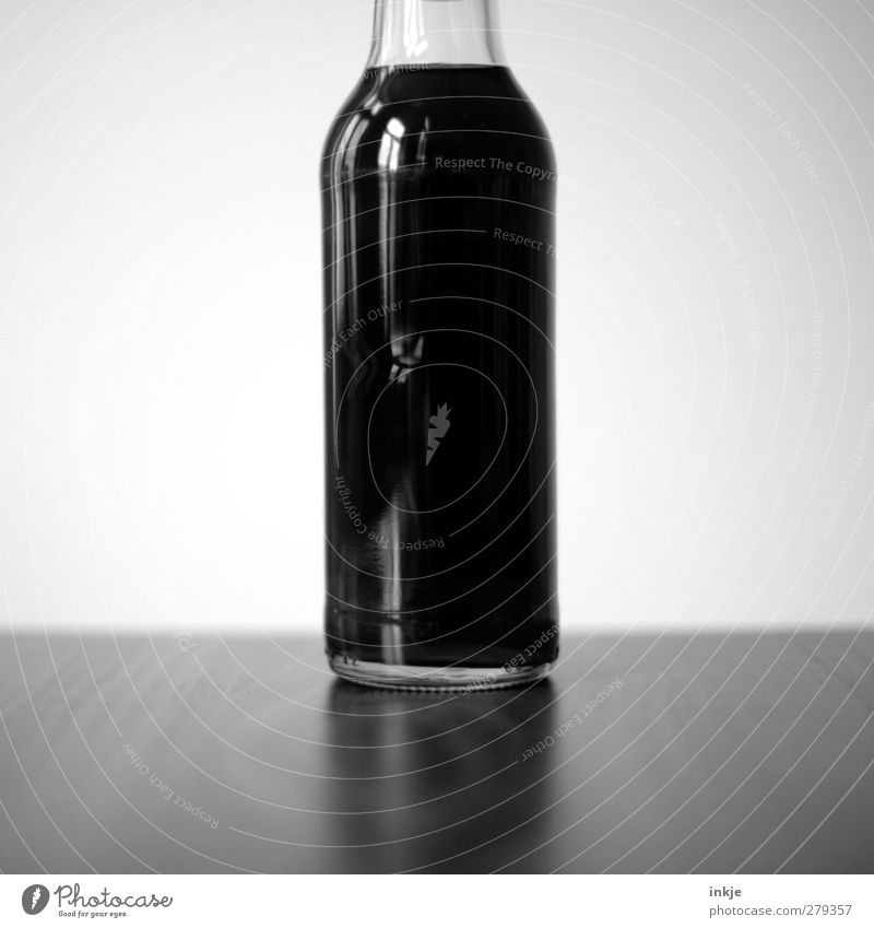 pure poison Beverage Cold drink Lemonade Cola Bottle Glassbottle coke bottle Stand Sweet Black Full Unhealthy Caffeine Refreshment Bright background Middle