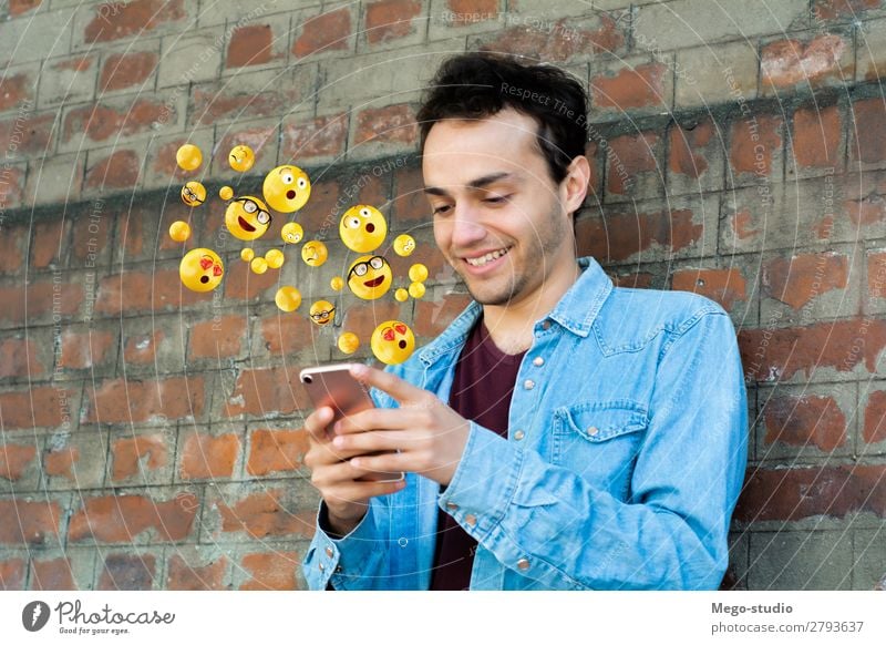 Man using smartphone sending emojis Lifestyle Happy Face Telephone PDA Screen Technology Internet Human being Adults Hand Funny Modern Smart Emotions young