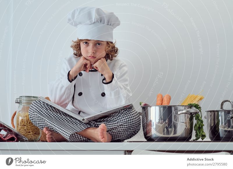 baby with big cooking pot Stock Photo