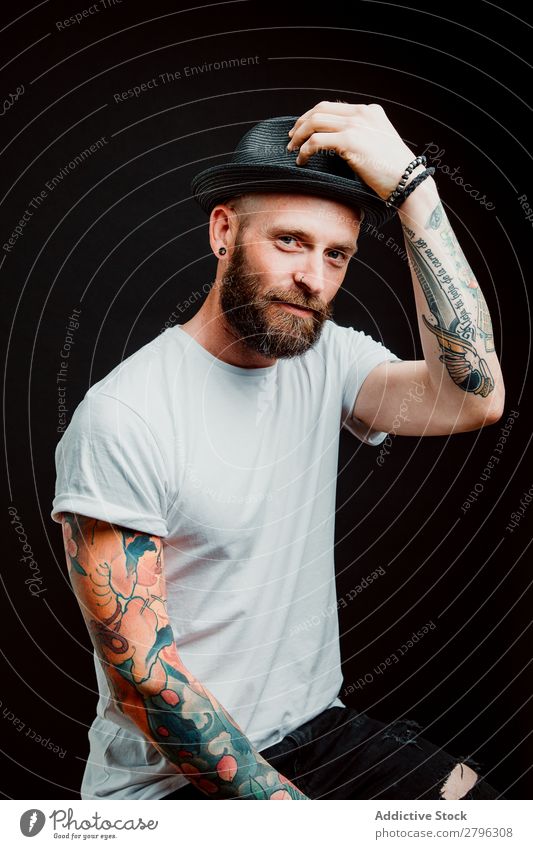 Smiling young guy in hat Man Hipster Tattoo Youth (Young adults) Guy bearded Hat T-shirt Hand Cheerful Easygoing Happy handsome Cool (slang) Style Hip & trendy