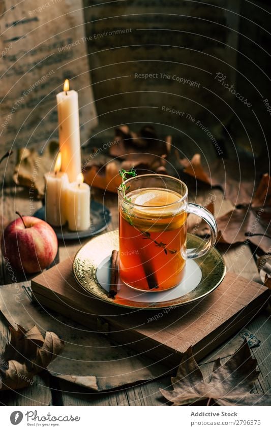 Tea near candles and apple Apple Candle Leaf Autumn Cup Flame Hot Drinking Warmth Beverage Lemon Aromatic Fire decor Design Vintage Retro Shabby Seasons Rustic
