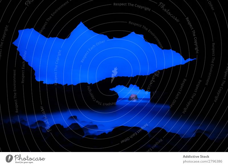 Amazing cave near water and blue sky Cave Stone Water Sky darkness hierro island Canaries Spain Night Canyon Ocean Heaven Surface Blue Rock Coast Splash