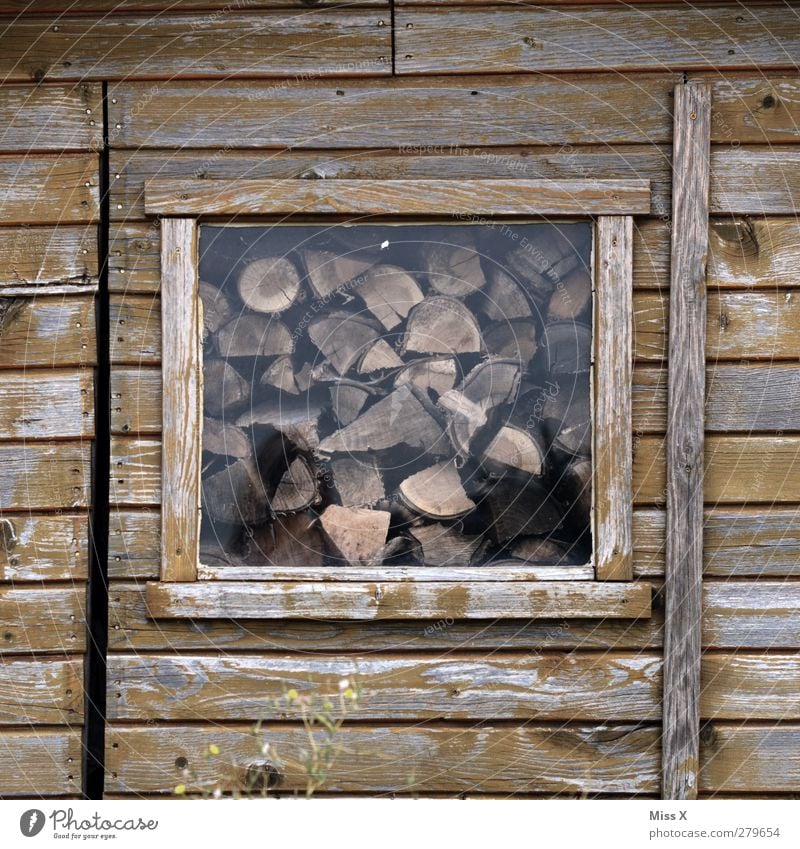 Wood in front of the hut II Hut Brown Firewood Wooden board Wooden hut Window Supply Colour photo Exterior shot Pattern Structures and shapes Deserted