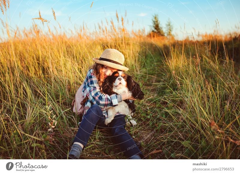 happy child girl enjoying summer vacations with her dog Lifestyle Joy Leisure and hobbies Playing Vacation & Travel Trip Adventure Freedom Expedition Summer