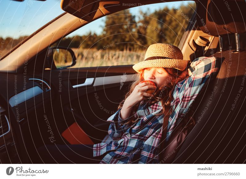 happy child girl eating apple in car. Lifestyle Joy Happy Leisure and hobbies Playing Vacation & Travel Trip Adventure Freedom Expedition Summer Hiking Child