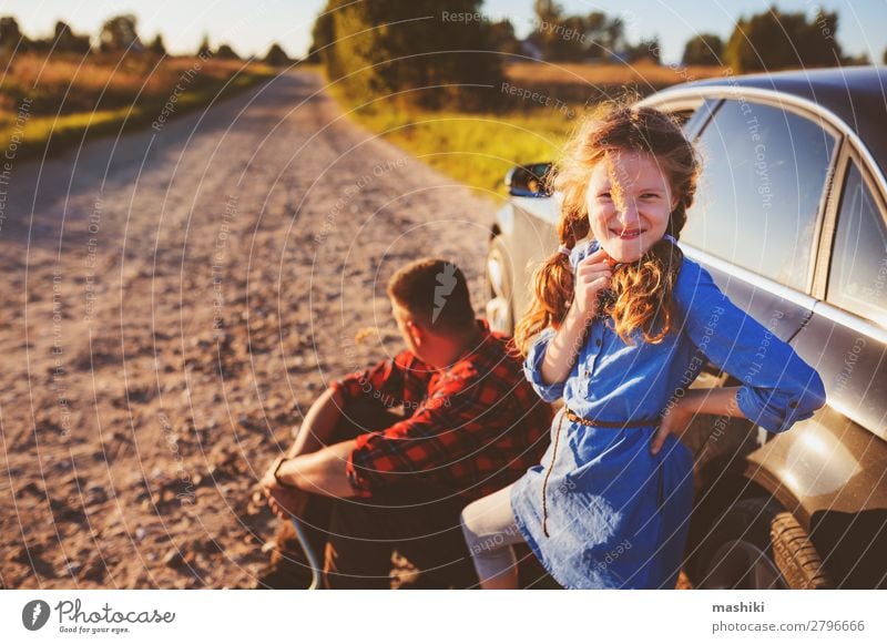 father and daughter changing broken tire Summer Child School Work and employment Engines Man Adults Parents Father Family & Relations Transport Street Vehicle