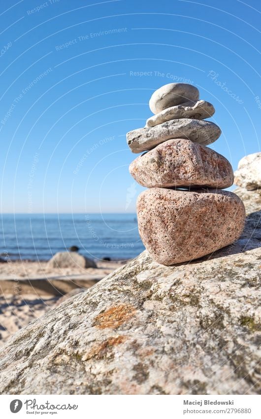 Stack of stones on a beach. Harmonious Contentment Relaxation Meditation Summer Beach Ocean Nature Sky Rock Stone Blue Acceptance Trust Serene Patient Balance