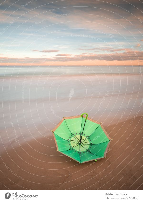 Umbrella on beach near sea Beach Ocean Sunset Evening Sky Clouds Waves Vacation & Travel Coast Sand Trip Tourism Dusk Twilight Water Paradise Resort Sunshade