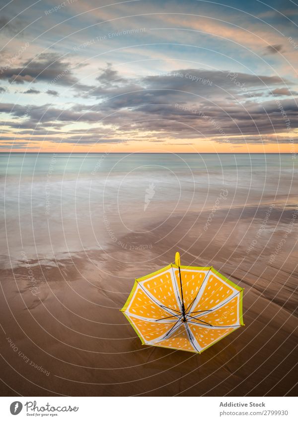 Umbrella on beach near sea Beach Ocean Sunset Evening Sky Clouds Waves Vacation & Travel Coast Sand Trip Tourism Dusk Twilight Water Paradise Resort Sunshade