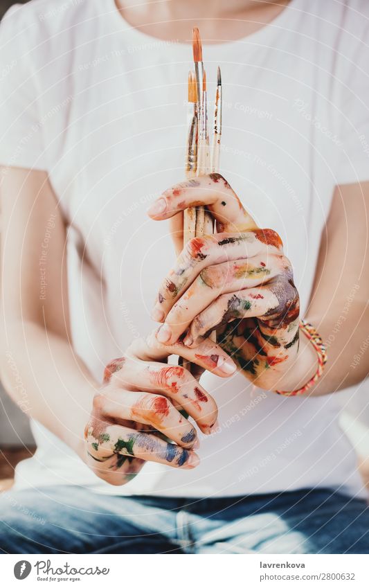 Closeup of woman's painted hands holding paint brushes Adults Loneliness Brush Conceptual design Creativity Design Designer Detail Education School Equipment