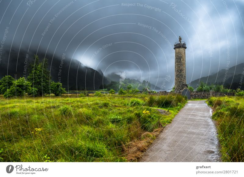 Glenfinnan Monument At Loch Shiel In Scotland bonnie prince charly charles clans clouds cloudy column destination environment fog foggy forest glen glenfinnan