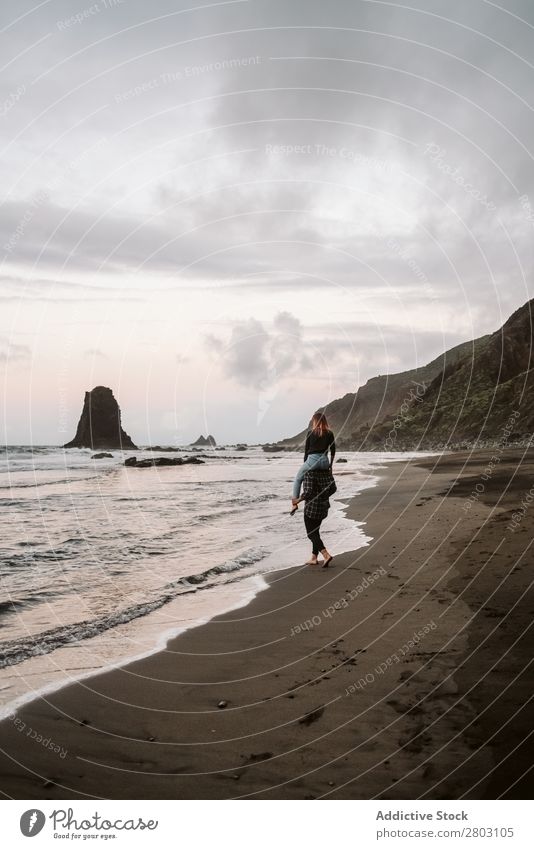 Unrecognizable man carrying woman on shoulders near sea Couple piggyback Ocean Coast Together Sand Clouds Sky Love Vacation & Travel Joy Man Woman Easygoing